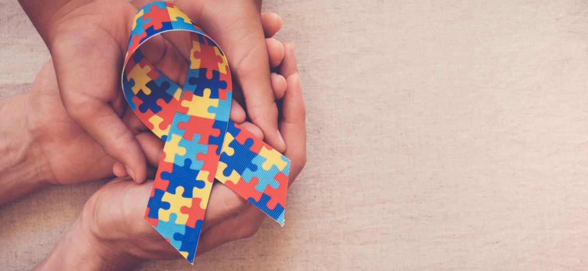 Hands,Holding,Puzzle,Ribbon,For,World,Autism,Spectrum,Disorder,Awareness